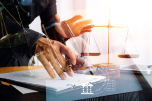 Business and lawyers discussing contract papers with brass scale on desk in office. Law, legal services, advice, justice and law concept picture with film grain effect